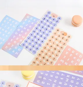 Detail of macaron pastel alphabet stickers with cute dog designs for scrapbooking DIY