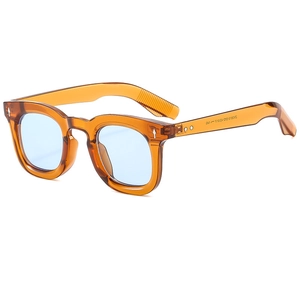 Retro amber round frame sunglasses with light blue lenses and silver rivets for street style