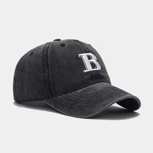 Faded black cotton baseball cap featuring 3D white letter B embroidery from a 45-degree angle