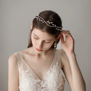 Elegant bridal hair vine and earrings set featuring white pearls and gold crystal accents