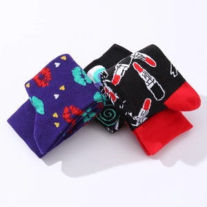 Three pairs of stylish cotton socks with lip and makeup patterns in black and purple
