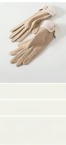 Close-up of camel thermal gloves featuring buttons, ribbed cuffs, and 41g lightweight material
