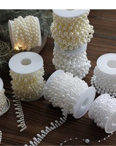 Close-up of assorted white artificial pearl beads for Christmas tree DIY decorations