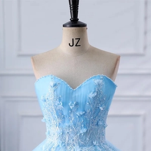 Elegant light blue strapless evening gown with white lace embroidery and 3D floral details