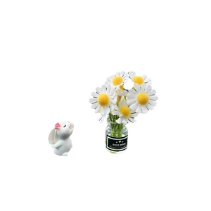 Mini rabbit figurine with white daisy glass vase car ornament on white background