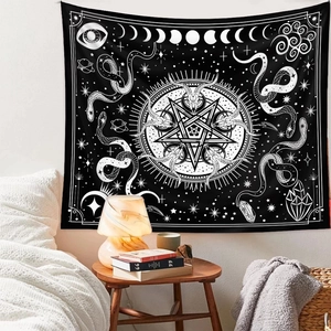 Detail of mystical wall tapestry with snake and moon phases displayed in a cozy bedroom setting