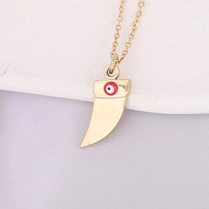 Golden crescent horn necklace with red and white enamel evil eye charm on fine chain