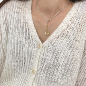 Minimalist 925 sterling silver asymmetrical necklace with golden heart pendant on model