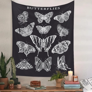 Detail of vintage butterfly wall tapestry in a cozy room with books and green plants