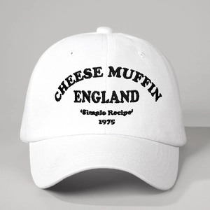 White cotton baseball cap with black Cheese Muffin England 1975 embroidery and adjustable strap