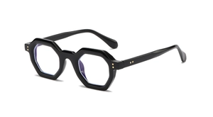 Detail of black thick hexagonal glasses frame with stylish metal rivet accents