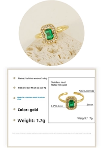 Detail view of gold stainless steel ring with rectangle green zircon and adjustable band