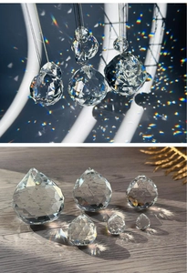Detailed macro of multifaceted crystal prisms reflecting rainbow light on wood