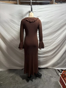 Detail of dark brown sheer mesh knit dress featuring ruffle collar and flared sleeves