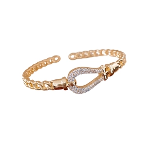 18K gold plated teardrop open bangle with horseshoe buckle and zircon crystals