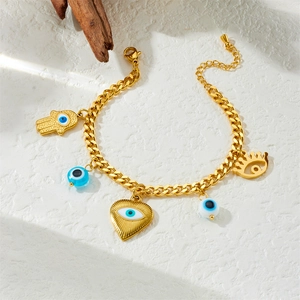 Gold stainless steel chain bracelet with colorful evil eye and heart charms on stone