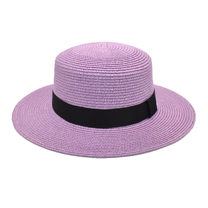 Lavender straw boater hat with black ribbon bow and fine weave on white background