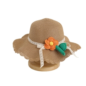 Kids summer straw sun hat with wavy brim, lace ribbon and cute floral decoration
