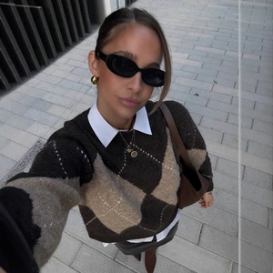 Women's retro argyle knit sweater in brown and beige with a stylish layered look