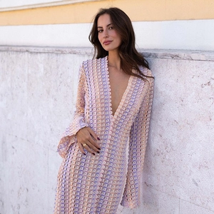 Detail of bohemian V-neck crochet maxi dress with colorful knitted pattern