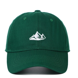 Dark green baseball cap featuring white mountain embroidery and cotton twill texture