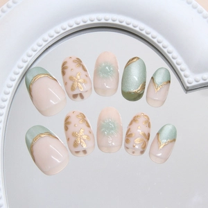 Press on nails set with mint green cat eye effect and gold floral art design