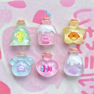 Detailed view of six mini colorful resin ocean wishing bottles in various cute shapes