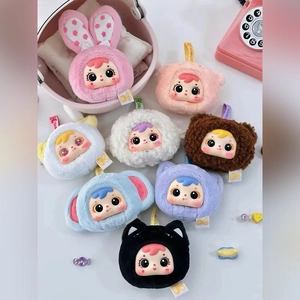 Close-up of colorful plush doll pendants featuring cute rabbits and bears in soft fabric