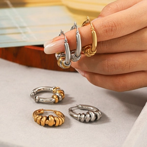 Polished stainless steel hoop earrings with spiral texture in gold and silver finish