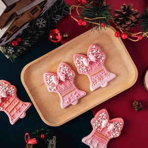 Pink Christmas bell fondant mold with reindeer and snowflake relief for cake decorating