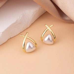 Detail of cross geometric earrings with gold trim and inlaid pearl white accents