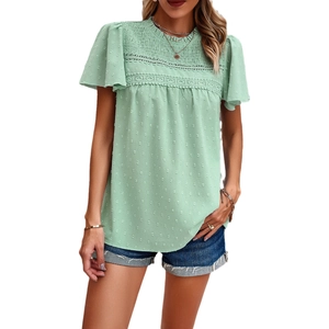 Pale green polka dot short sleeve top with lace trim and ruffled sleeves on white background
