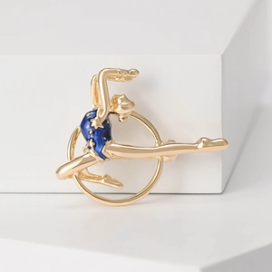 Elegant gold rhythmic gymnastics girl brooch with blue enamel on a white geometry background