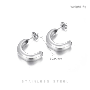 Detail view of silver C-shaped stainless steel earrings with dimensions 22x7mm