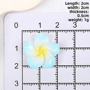 Detail view of a 2cm gradient blue resin plumeria flower accessory with size measurements