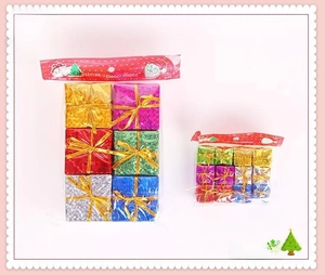 Detail view of colorful laser foam gift box ornaments for Christmas tree decoration