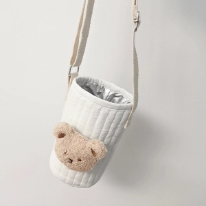 Detail of white quilted water bottle bag with a cute 3D plush bear and adjustable strap
