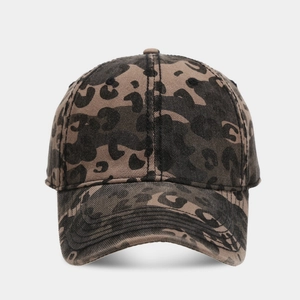 Detailed view of leopard print texture on vintage washed cotton baseball cap fabric