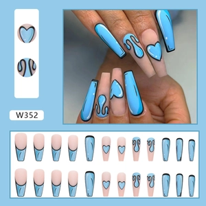 Detailed view of 2D comic style press-on nails with blue and nude heart designs