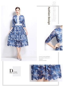 Detail of blue floral lace dress showing white hollow crochet waist and embroidery