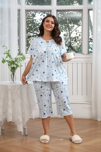 Detail of light blue plus size home wear set featuring a celestial star and moon pattern
