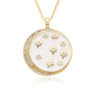 Detail of a gold-plated crescent star pendant with white enamel and sparkling crystals