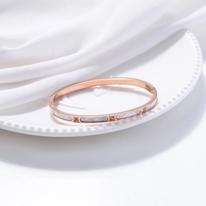 Elegant rose gold stainless steel bracelet with white marble inlay and sparkling crystals