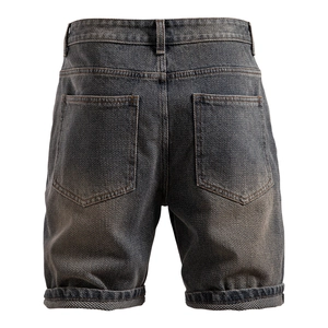 Detailed back view of vintage star-patterned denim shorts featuring herringbone texture
