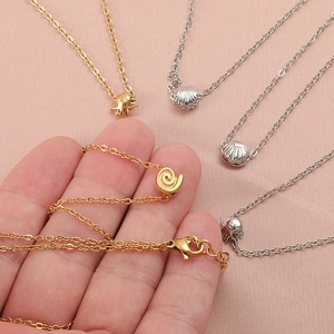 Golden starfish and shell pendant necklaces in stainless steel for beach summer style