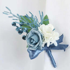Blue rose wedding boutonniere with silk ribbon and berries for groom and guests