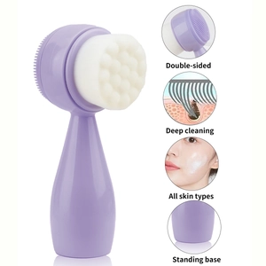 Close-up of dual-sided silicone facial brush with soft bristles and upright stand base