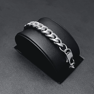 Polished stainless steel Cuban chain necklace with lobster clasp on professional display