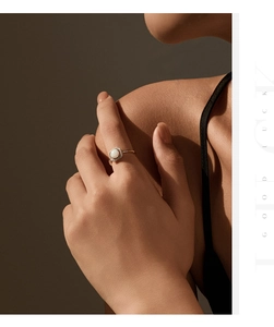 Elegant halo ring with synthetic opal and micro-pave diamonds on a rose gold band