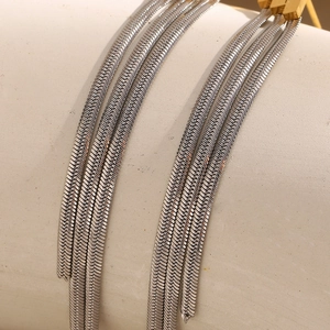 Macro shot of silver snake chain fringe details with polished stainless steel texture